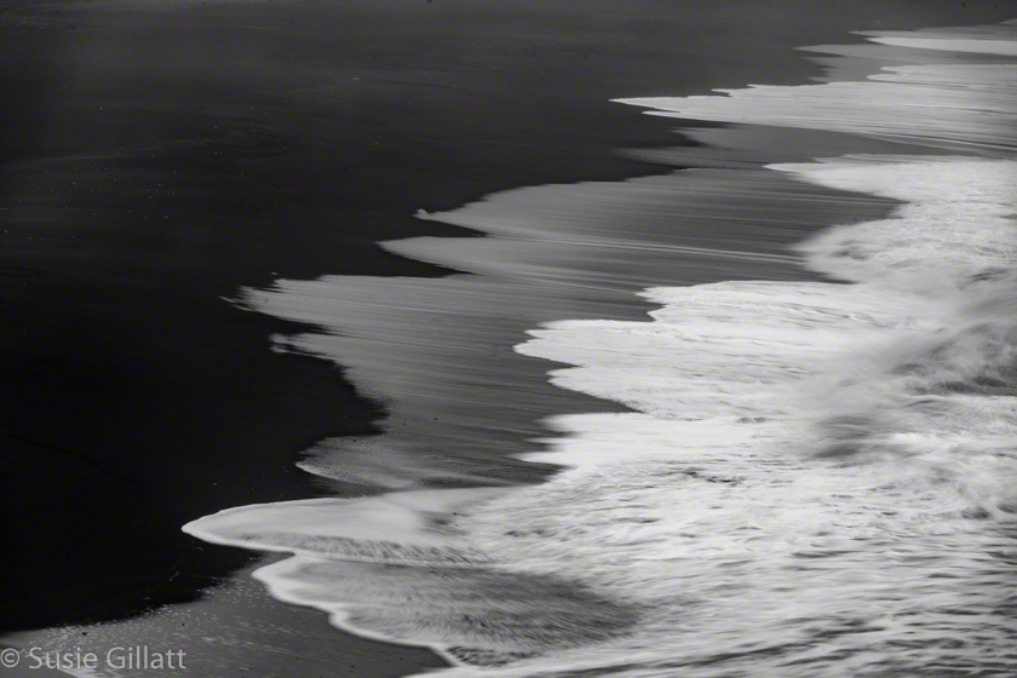 abstract black sand beach with waves