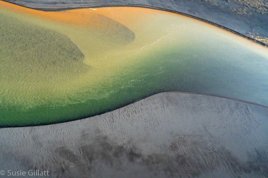 abstract aerial photo of rivers with colorful minerals